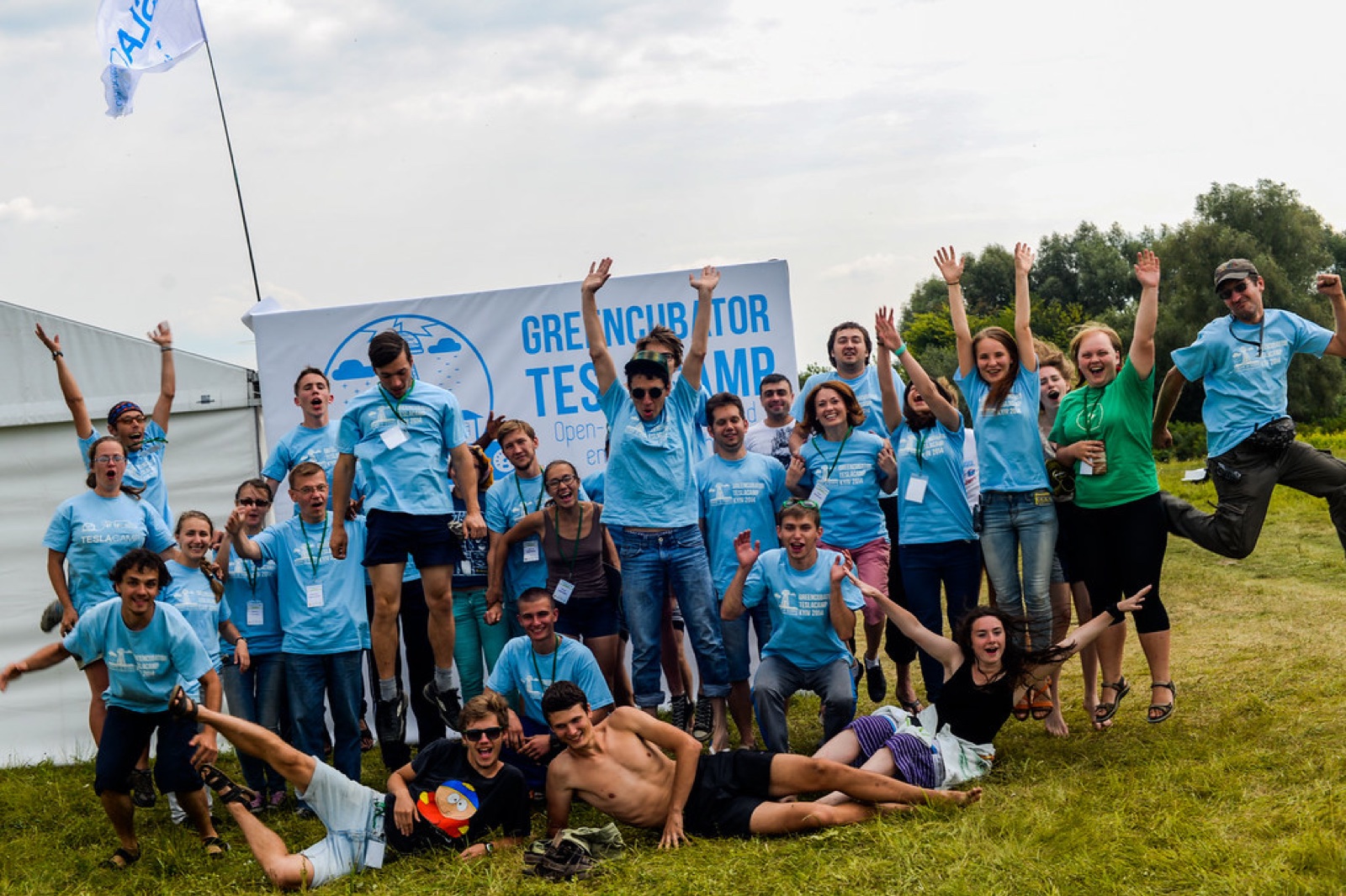 TeslaCamp 2014 participants celebrating together outdoors