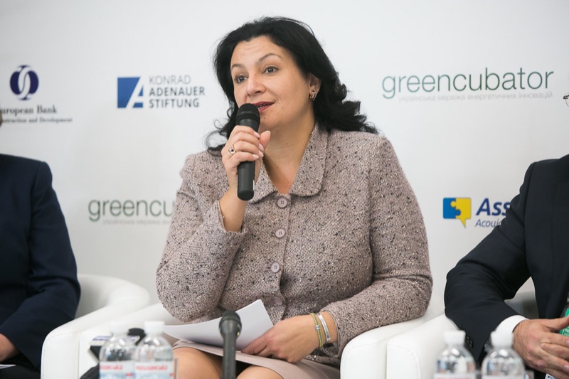 Speaker at Greencubator conference with partner logos